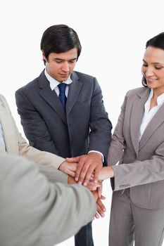 Salesteam motivating each other against a white background