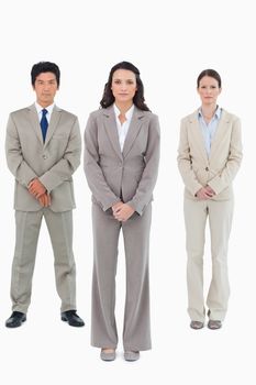 Businesswoman with her team behind her against a white background