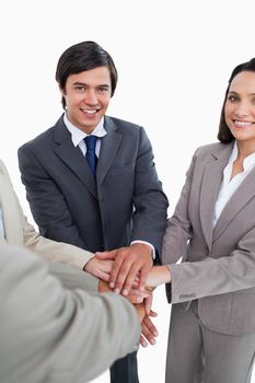 Young businessteam self-motivating against a white background