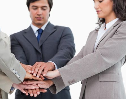 Hands of salespeople together against a white background