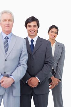 Young businesspeople with their mentor against a white background