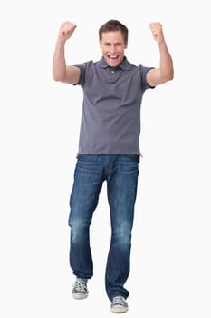 Cheering young man against a white background