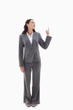Businesswoman presenting a product on the top against white background