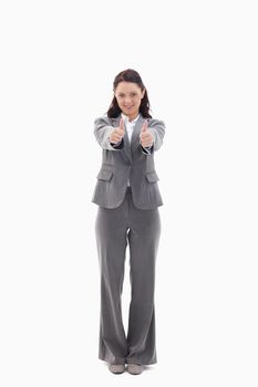 Businesswoman giving her agreement against white background