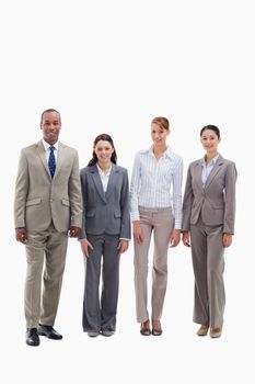 Business team smiling side by side against white background