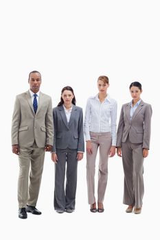 Serious business team side by side against white background