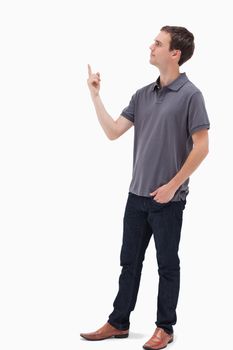 Man standing and presenting something above against white background