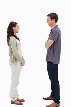 Couple laughing face to face against white background