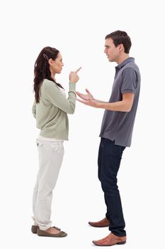 Woman scolding man against white background