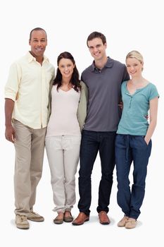 Two couples smiling against white background