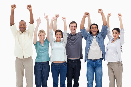 People raising their arms against white background