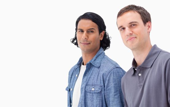 Close-up of two men against white background