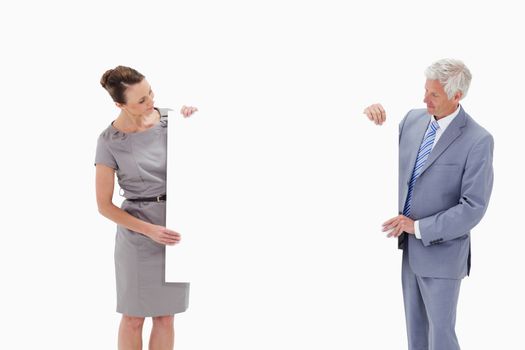 White hair businessman looking and holding a big white sign with a woman against white background