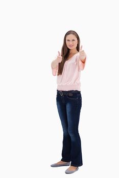 Woman the thumbs-up against white background