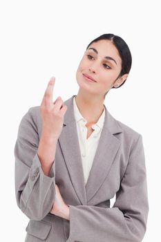Businesswoman looking at her fingertips against a white background