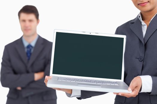 Close up of laptop screen being presented by salesteam against a white background
