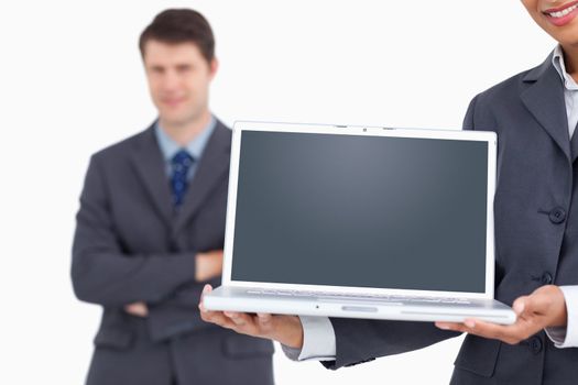 Close up of notebook screen being presented by salesteam against a white background