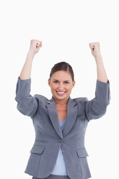 Close up of cheering tradeswoman against a white background