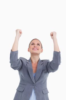 Close up of celebrating tradeswoman against a white background