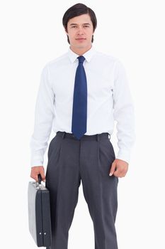 Tradesman with suitcase against a white background