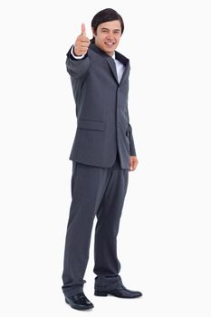 Tradesman giving thumb up against a white background