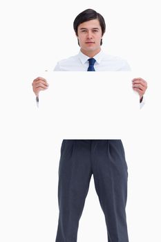 Tradesman holding blank sign against a white background