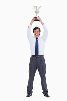 Successful tradesman holding cup against a white background