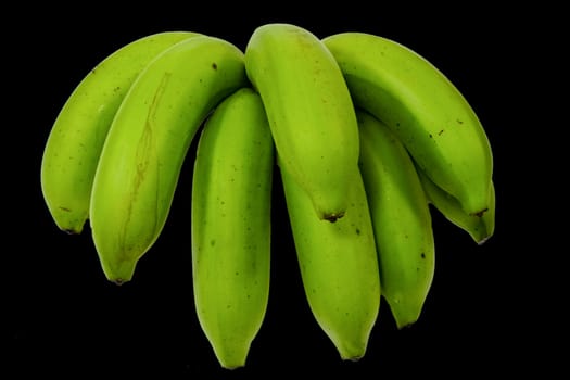 bunch of green bananas on background