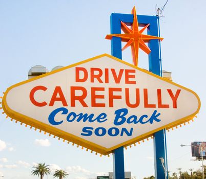 A sign asks you to return soon as you leave Las Vegas