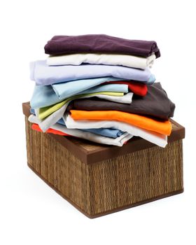 Stack of Clothes on Packing Straw mat Box isolated on white background