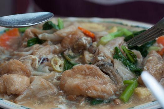 fried fish with vegetable on dish