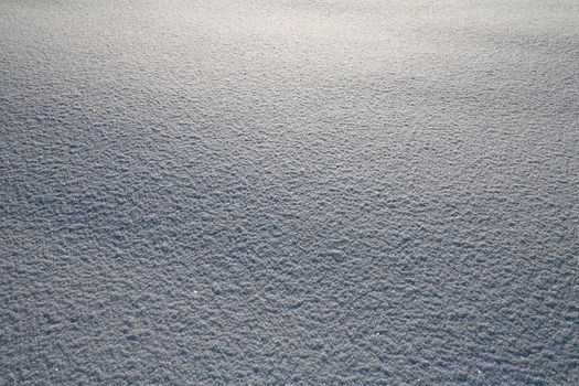 Details of a beautiful snow surface perfect for backgrounds on greeting cards etc.