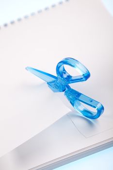 Scissors cutting paper