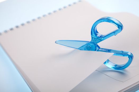 Scissors cutting paper