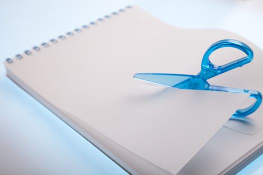 Scissors cutting paper
