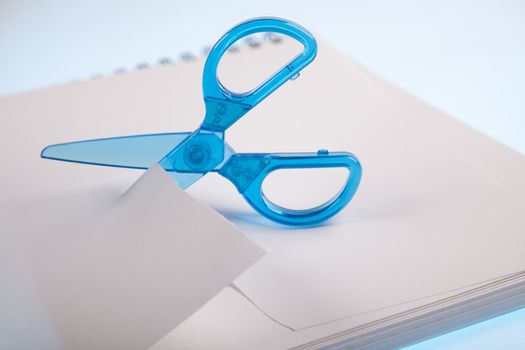 Scissors cutting paper
