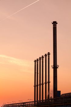 Factory chimneys at sunrise