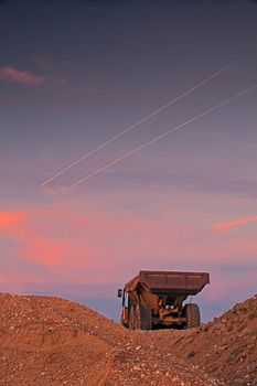 Picture of a large truck and light lines from airplane