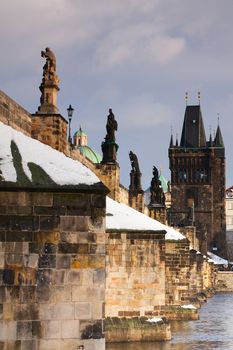 Famous Charles bridge on Vltava river in Prague in winter