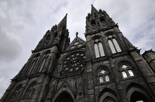 Front View of Clermont-Ferrand Cathedral with a cloudy sky