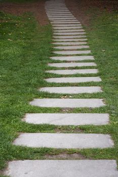 Stone pathway with green grass at France.