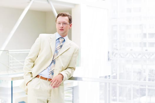 Smiling business man , on the balcony