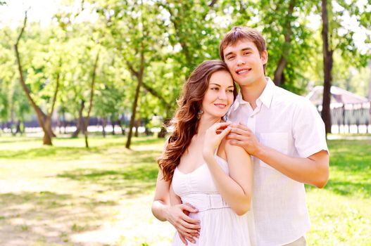 couple hugging in the park, have a good time together