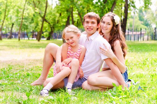 Family lying in the park, spend time with family