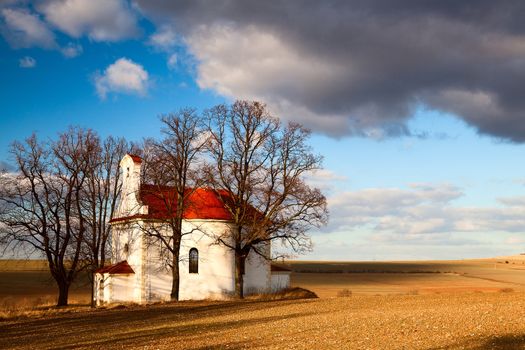 The ruins small church on the hill in spring