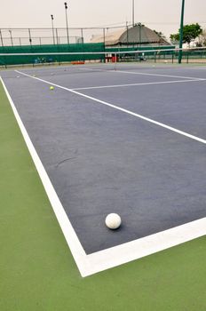 White Tennis ball on a tennis court