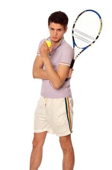 man with racket concentrated on playing tennis and preparing for the ball serving