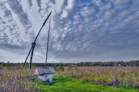 Kind on a rural well in Dmitrovsky area of Moscow Region