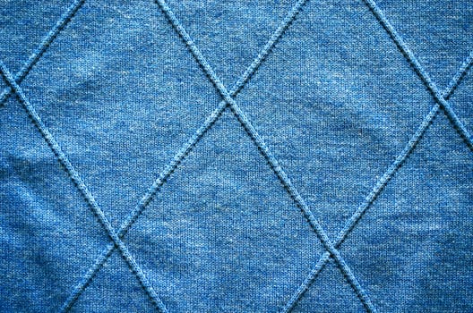 Cross lines on knitted sweater pattern fabric background.
