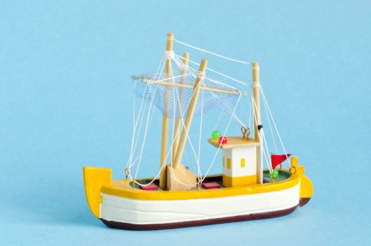 little ship model on azure background